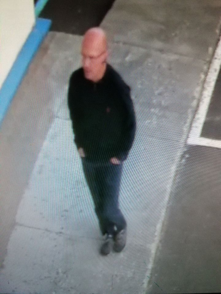Police looking to identify man after bottle of liquor was stolen from Pullman Sunset Mart